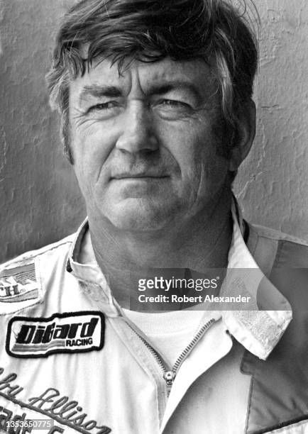 Driver Bobby Allison stands in the speedway garage prior to the start of the 1982 Daytona 500 stock car race at Daytona International Speedway in...