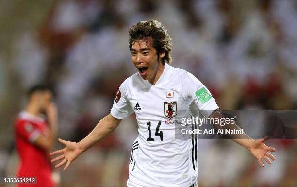Junya Ito of Japan celebrates after scoring their side's first goal during the FIFA World Cup Asian Qualifier final round Group B match between Oman...