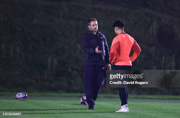 England fly half Marcus Smith talks with Jonny Wilkinson during an England training session ahead of their upcoming match against South Africa on...