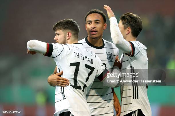 Jan Thielemann of Germany celebrates scoring the 4th team goal with his team mates Jamie Leweling and Noah Katterbach during the 2022 UEFA European...
