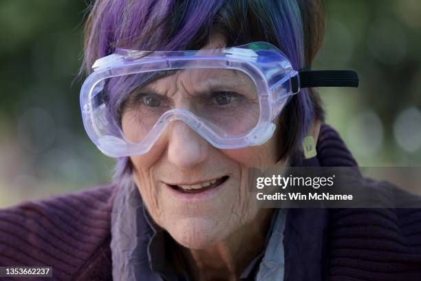 Rep. Rosa DeLauro wears protective goggles before working with molten metal during a “Swords to Plowshares” event near the U.S. Capitol November 16,...