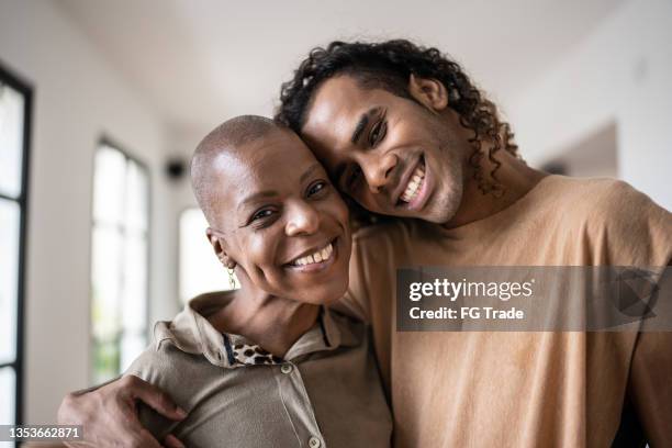 portrait of mother and son at home - union gay stockfoto's en -beelden