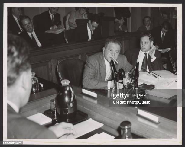 View of American actor Lionel Stander as he testifies before the House Un-American Activities Committee , New York, New York, March 1953. He was...