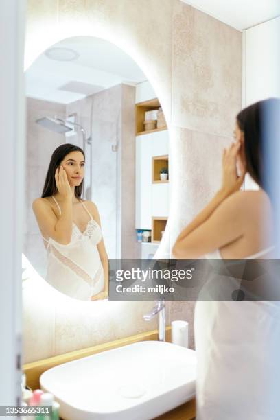 young woman enjoying being pregnant. - body care and beauty stock pictures, royalty-free photos & images
