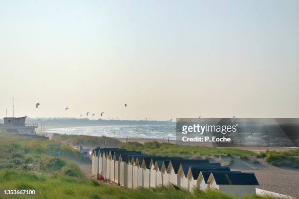 ouistreham, bathing cabins and fly surf along the beach - ouistreham stock pictures, royalty-free photos & images