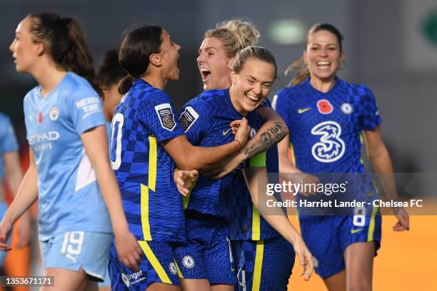 Magdalena Eriksson of Chelsea celebrates with teammates Sam Kerr and Millie Bright after scoring her team's fourth goal during the Barclays FA...