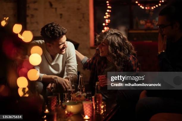 remembering funny stories together - man party night bar posing stock pictures, royalty-free photos & images