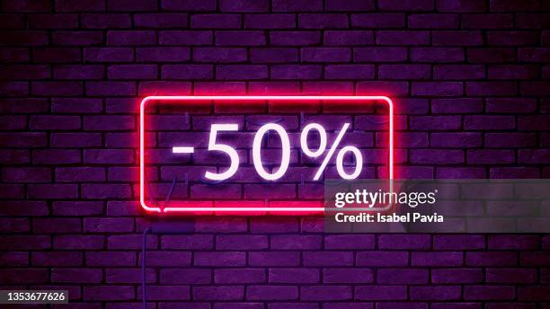 "-50%" message in neon lights - fluorescent stock-fotos und bilder