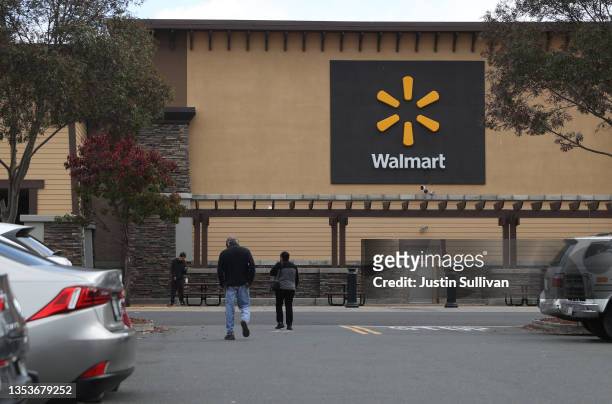 Customers enter a Walmart store on November 16, 2021 in American Canyon, California. Walmart reported better-than-expected third quarter earnings...