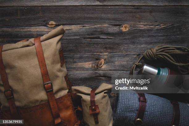 trekking equipment on wooden background - drawing compass stock pictures, royalty-free photos & images