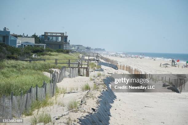 This is a view of the sand dune and beach in front of oceanfront houses on the Fire Island community of Saltaire, New York, on August 3, 2015.