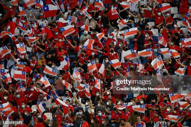 Fans of Chile cheer for their team during a match between Chile and Ecuador as part of FIFA World Cup Qatar 2022 Qualifiers at San Carlos de...