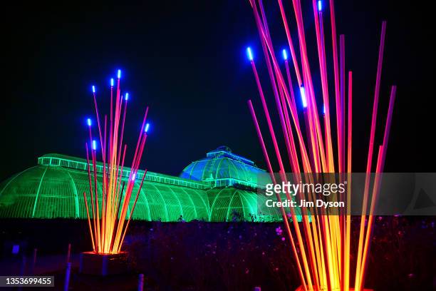 The Palm House at Kew Gardens is illuminated with a light show during a preview for the Christmas at Kew event on November 16, 2021 in London,...