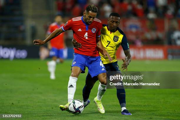 Mauricio Isla of Chile and Pervis Estupiñan fight for the ball of Ecuador during a match between Chile and Ecuador as part of FIFA World Cup Qatar...