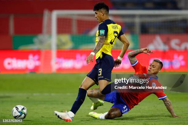 Piero Hincapie of Ecuador and Eduardo Vargas of Chile fight for the ball during a match between Chile and Ecuador as part of FIFA World Cup Qatar...
