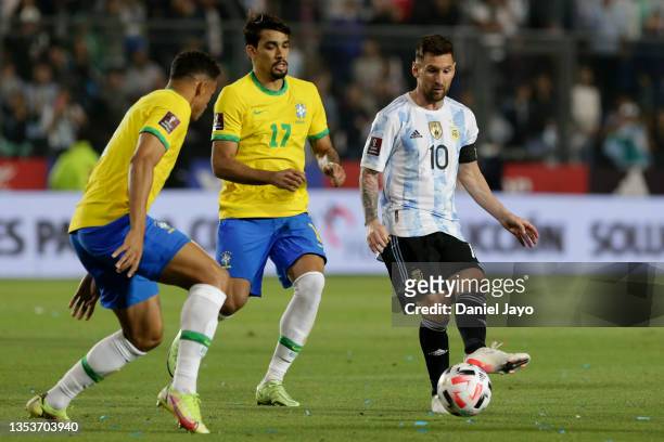 Lionel Messi of Argentina competes for the ball with Lucas Paquetá and Danilo da Silva of Brazil during a match between Argentina and Brazil as part...