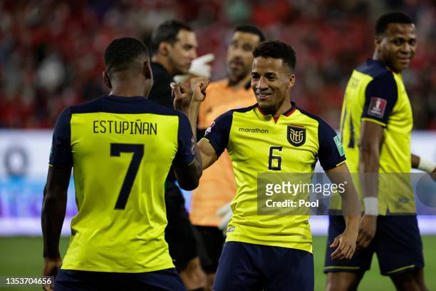 Pervis Estupiñan of Ecuador celebrates with Byron Castillo of Ecuador after scoring the opening goal during a match between Chile and Ecuador as part...