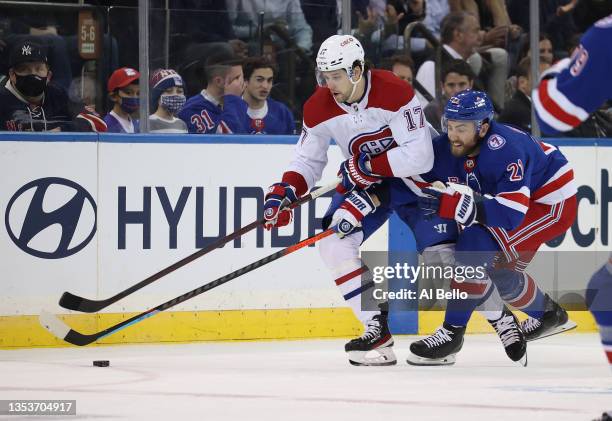 Josh Anderson of the Montreal Canadiens and Barclay Goodrow of the New York Rangers battle for the puck during their game at Madison Square Garden on...
