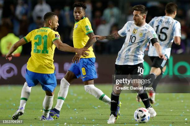 Matheus Cunha of Brazil competes for the ball with Lionel Messi of Argentina during a match between Argentina and Brazil as part of FIFA World Cup...