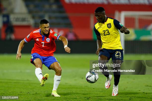 Alexis Sanchez of Chile and Moises Caicedo of Ecuador fight for the ball during a match between Chile and Ecuador as part of FIFA World Cup Qatar...
