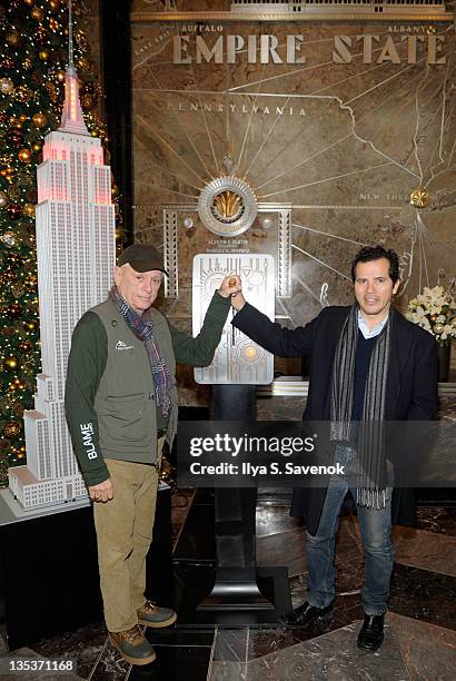 Ric O'Barry and John Leguizamo light the The Empire State Building to raise awareness for the protection of dolphins in Japan on December 9, 2011 in...