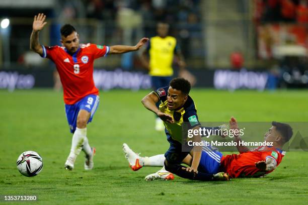 Claudio Baeza of Chile fights for the ball with Byron Castillo of Ecuador during a match between Chile and Ecuador as part of FIFA World Cup Qatar...