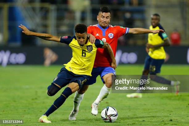 Byron Castillo of Ecuador and Jean Meneses of Chile fight for the ball during a match between Chile and Ecuador as part of FIFA World Cup Qatar 2022...
