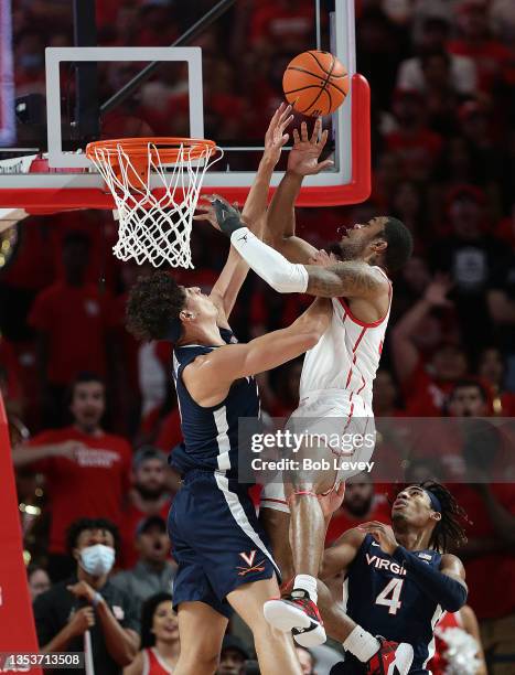 Fabian White Jr. #35 of the Houston Cougars jumps to the basket against Kadin Shedrick of the Virginia Cavaliers during the first half at Fertitta...