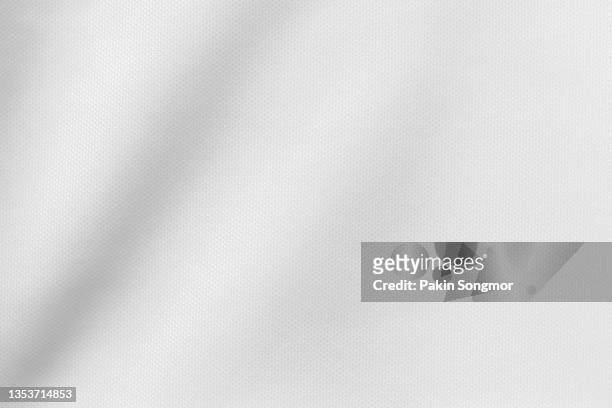 white color sports clothing fabric football shirt jersey texture and textile background. - materiale tessile foto e immagini stock