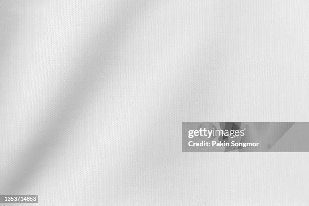 white color sports clothing fabric football shirt jersey texture and textile background. - carbon fiber texture stockfoto's en -beelden