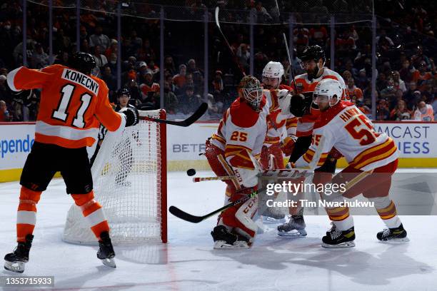 Jacob Markstrom of the Calgary Flames blocks a shot by Travis Konecny of the Philadelphia Flyers during the second period at Wells Fargo Center on...