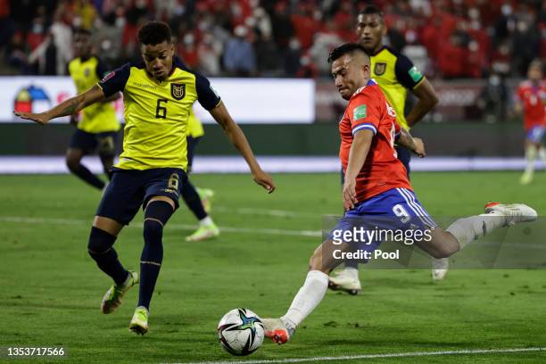 Jean Meneses of Chile takes a shot as Byron Castillo of Ecuador defends during a match between Chile and Ecuador as part of FIFA World Cup Qatar 2022...