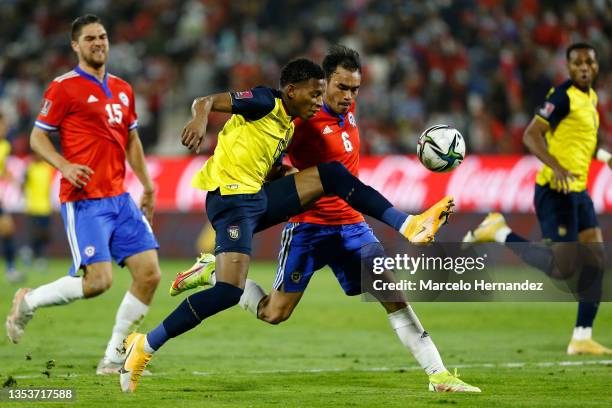 Gonzalo Plata of Ecuador and Gabriel Suazo of Chile fight for the ball during a match between Chile and Ecuador as part of FIFA World Cup Qatar 2022...