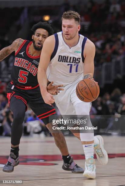 Luka Doncic of the Dallas Mavericks moves against Derrick Jones Jr. #5 of the Chicago Bulls at the United Center on November 10, 2021 in Chicago,...