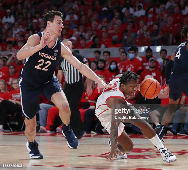 Marcus Sasser of the Houston Cougars drives baseline on Francisco Caffaro of the Virginia Cavaliers during the second half at Fertitta Center on...