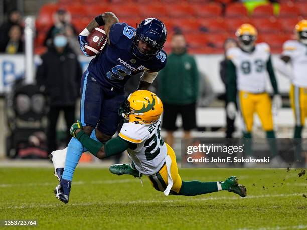 Walter Fletcher of the Edmonton Elks tackles Josh Huff of the Toronto Argonauts on a punt return at BMO Field on November 16, 2021 in Toronto,...