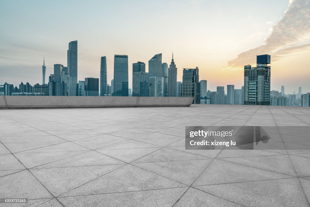 Tile floor parking lot and city skylineの写真素材