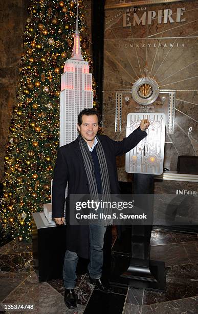 John Leguizamo lights the The Empire State Building to raise awareness for the protection of dolphins in Japan on December 9, 2011 in New York City.