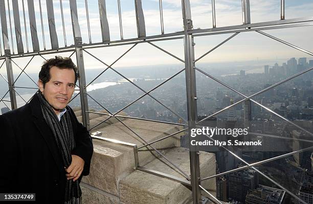 John Leguizamo lights the The Empire State Building to raise awareness for the protection of dolphins in Japan on December 9, 2011 in New York City.