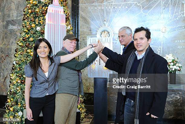 Leilani Munter, Ric O'Barry, Louie Psihoyos and John Leguizamo light the The Empire State Building to raise awareness for the protection of dolphins...