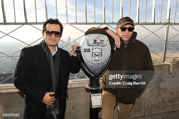 John Leguizamo and Ric O'Barry light the The Empire State Building to raise awareness for the protection of dolphins in Japan on December 9, 2011 in...