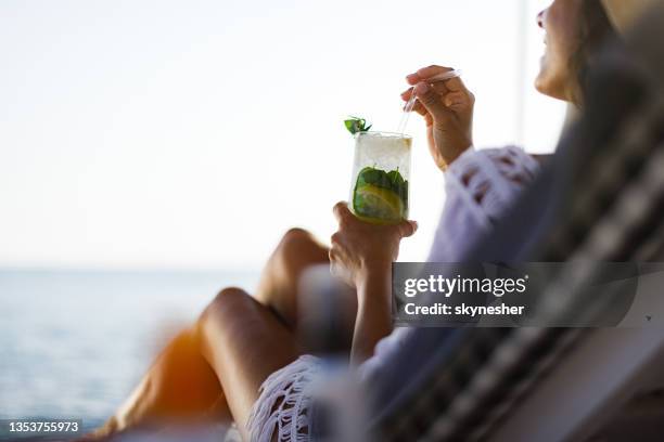 drinking cocktail on the beach! - santorini stock pictures, royalty-free photos & images