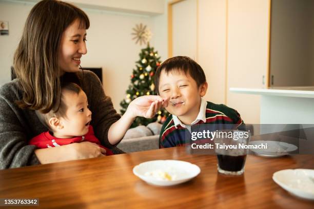 a japanese family enjoying christmas cake - christmas tree close up stock pictures, royalty-free photos & images