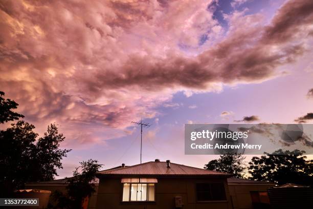 rain storm clouds over house at dusk, rural australia - australian house dusk stock pictures, royalty-free photos & images