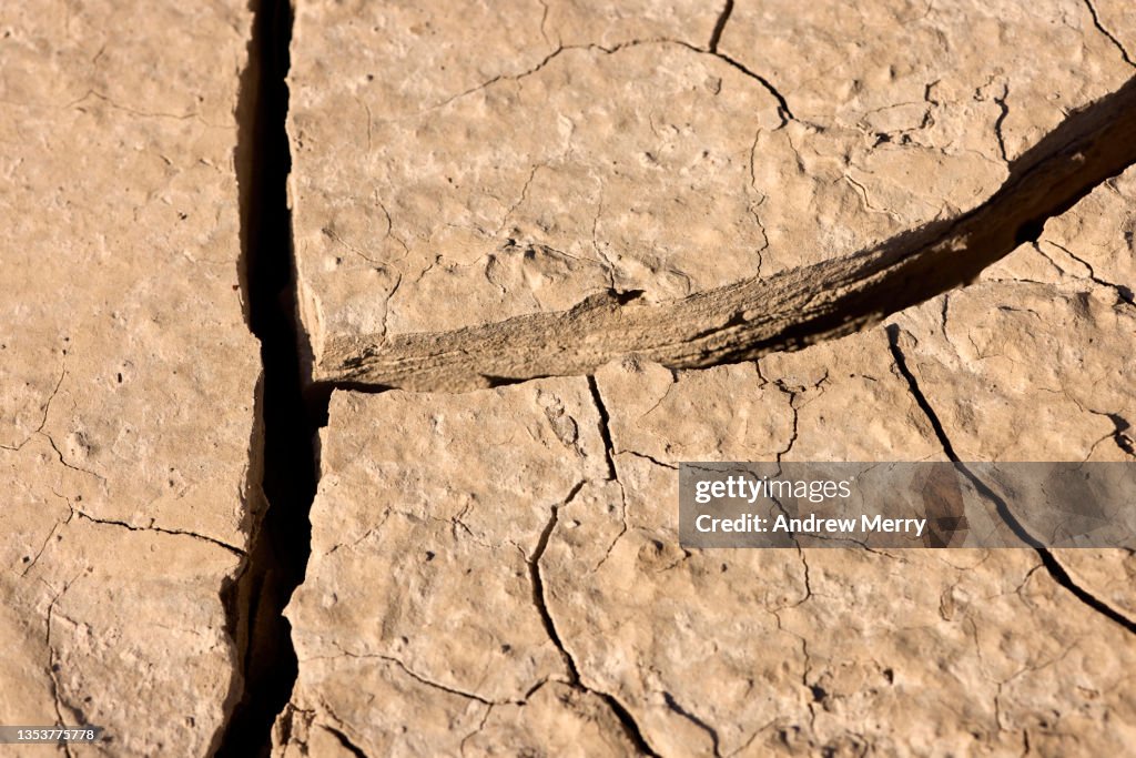 Dried out mud, cracked earth, riverbed in rural Australia, closeup