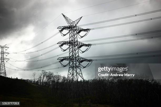 electricity pylon, tower, power line and storm clouds, rural australia - power cable stock pictures, royalty-free photos & images