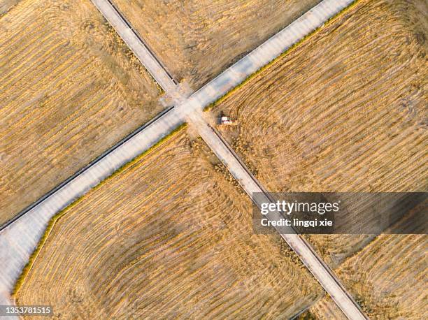 harvester parked on farmland after harvest - drone farm stock pictures, royalty-free photos & images