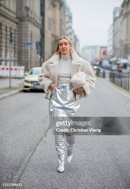 Tina Haase is seen wearing Solace London Metallic silver skirt, COS teddy jacket and clutch, Brian Atwood x Scarosso Silver boots on November 16,...