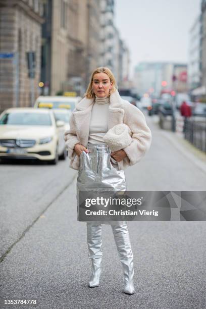 Tina Haase is seen wearing Solace London Metallic silver skirt, COS teddy jacket and clutch, Brian Atwood x Scarosso Silver boots on November 16,...