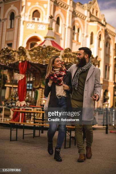 heterosexual couple walking in the city center - novi sad stock pictures, royalty-free photos & images